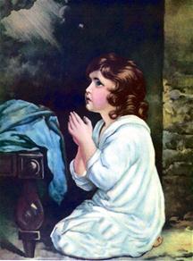 Een kind bidt voor het slapen gaan